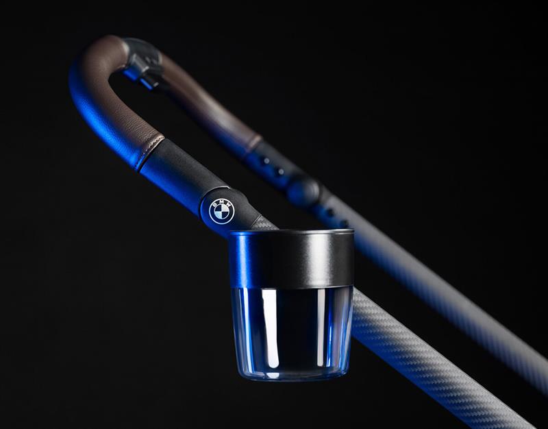 Closeup of BMW SWIV pushchair with cup holder accessory on handle