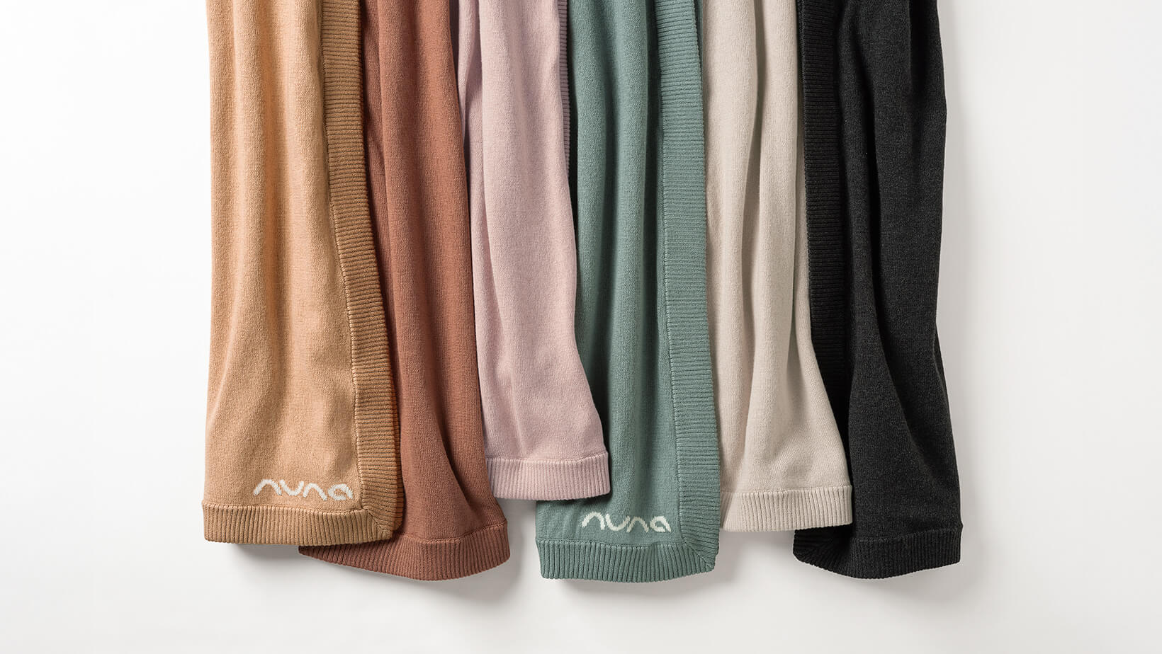 Six Nuna Cotton Blankets, one in each fashion